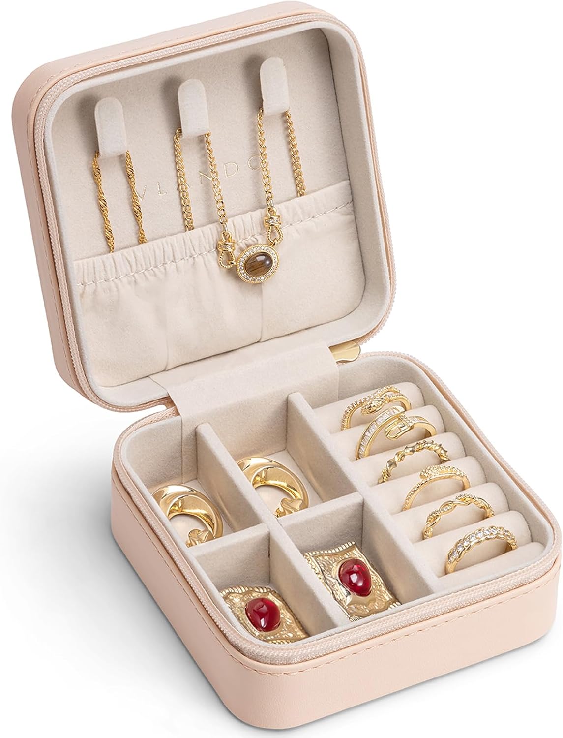 Pink travel jewelry case open with rings, earrings and necklaces