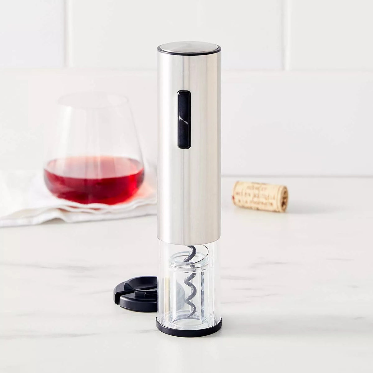 Electric wine opener and foil cutter on a marble counter
